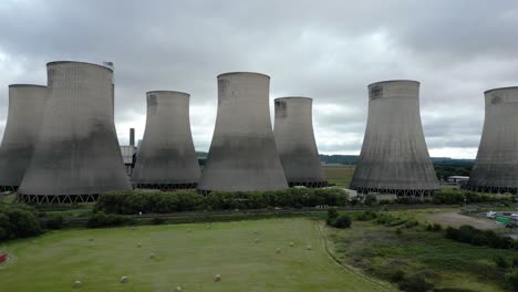 Aerial-view-Ratcliffe-on-Soar-power-station-cooling-towers-dolly-across-rural-agricultural-farmland