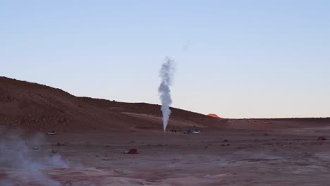 Cone-geyser-spews-hot-gas,-steam-on-arid-altiplano-desert-in-Bolivia