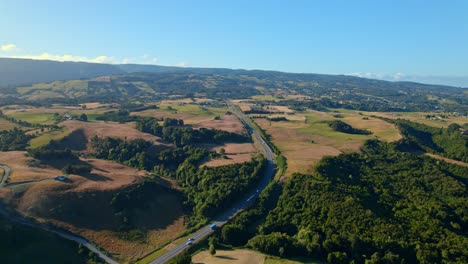 Aerial-Drone-landscape-fly-above-Chiloe-open-fields-in-patagonian-chilean-travel-destination,-environmental-scene,-roads-drive-through-meadow-highway