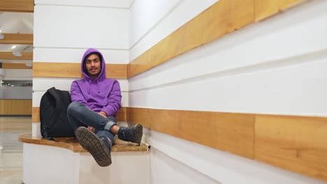 Lonely-Sri-Lankan-man-with-hoodie-sitting-in-the-corner-and-talk