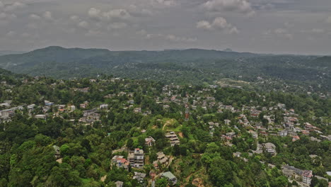 Kandy-Sri-Lanka-Aerial-v1-elevation-up-drone-flyover-A9-Katugastota-road-capturing-Wattarantenna-hillside-residential-suburbs-and-mountainous-landscape-views---Shot-with-Mavic-3-Cine---April-2023