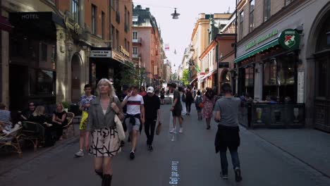 Slo-mo-shot-of-people-walking-on-Drottninggatan-in-Stockholm,-Sweden