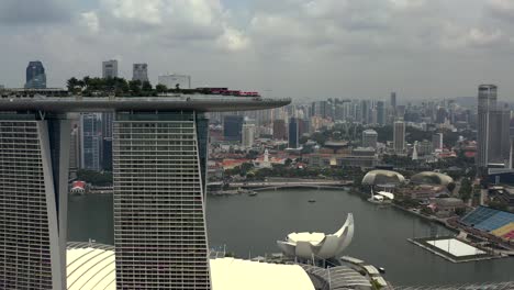 Marina-Bay-Sands-Hotel-with-Scenic-Views-of-Singapore-City-Panning-Into-View-from-an-Aerial-Drone