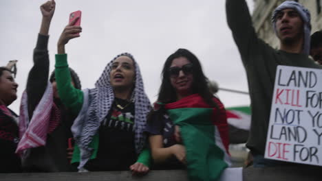 Arab-Women-in-Keffiyehs-at-a-Pro-Palestine-Protest-Holding-Up-Their-Fists-and-Cheering