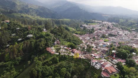 Colombian-settlement-in-the-mountain-Andes,-city-Salento,-aerial-orbit