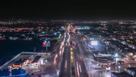 aerial-time-laps-on-the-city,-lights,-traffic-and-building