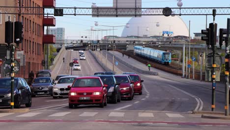 Cars,-street-traffic,-subway-train-and-Globe-Arena-in-Stockholm