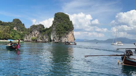 Long-tail-boats-sailing-around-limestone-gulf-south-of-Thailand-Asia