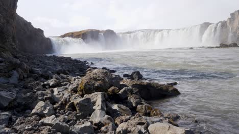 Beautiful-low-shot-of-Godafoss-waterfall-on-sunny-day,-North-Iceland