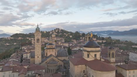 The-bell-towers-of-Bergamo-Alta-with-flock-of-birds