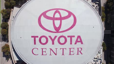 Toyota-Center-Arena,-Houston-TX-USA,-Top-Down-Aerial-View-of-Rooftop-Logo,-High-Angle-Drone-Shot