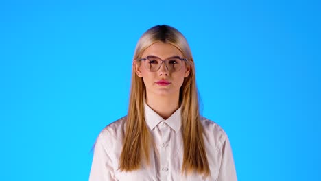 Blonde-Young-Caucasian-Lady-Plays-with-a-Healthy-Red-Apple,-Studio-Portrait-Shot