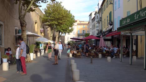 People-move-on-walking-street-by-restaurants-in-Antibes-in-2020