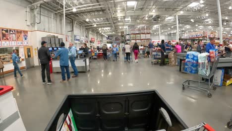 POV---At-Costco,-slowly-pushing-the-chart-from-the-Checkout-stand,-through-the-food-court-and-towards-the-exit