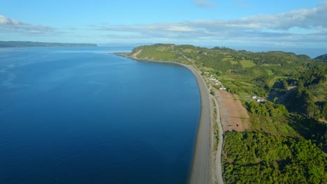 Aerial-view-of-the-desolate-beach-of-Detif-on-Lemuy-Island-in-the-Chiloe-Archipelago,-Chile-on-a-sunny-day