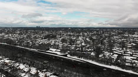 An-aerial-view-of-the-Southern-State-Parkway-on-Long-Island,-NY-on-a-cloudy-winter-day