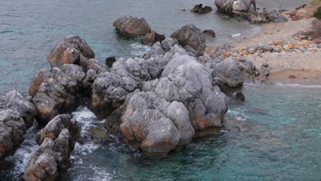 Beautiful-view-demonstrating-rocks-into-the-sea-in-Loutra,-Chalkidiki,-Greece