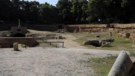 Ancient-Roman-ruins-in-Carthage,-Tunisia,-under-clear-blue-sky