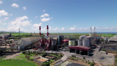 A-bustling-cement-factory-in-mauritius-with-clear-skies,-aerial-view