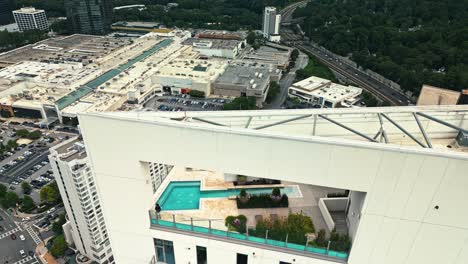 Rooftop-terrace-with-swimming-pool-on-top-of-skyscraper-building