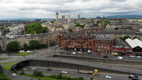Aerial-footage-of-Scotland's-Residential-Areas-by-busy-Motorway-traffic-,-Glasgow,-UK