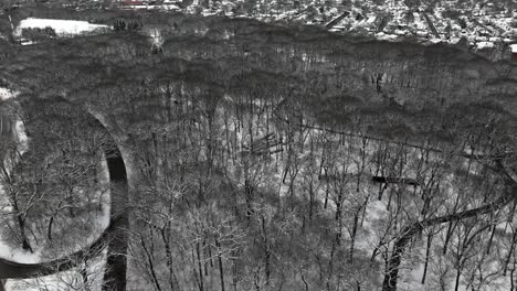 An-aerial-view-of-a-snow-covered-park-on-Long-Island-on-a-cloudy-winter-day