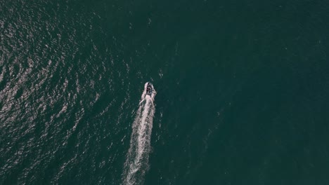 top-down-shot-of-a-small-boat-sailing-off-the-coast-of-mozambique