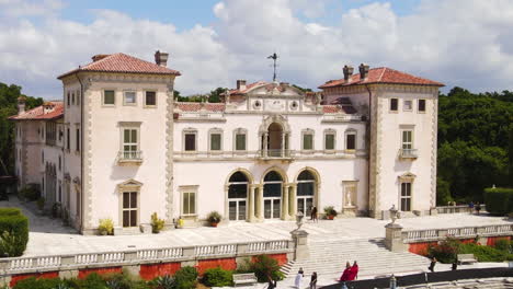 Aerial-View-of-Villa-Vizcaya-Museum-and-Gardens-on-Waterfront-of-Coconut-Grove,-Miami,-Florida-USA,-Historic-Landmark-on-Sunny-Day