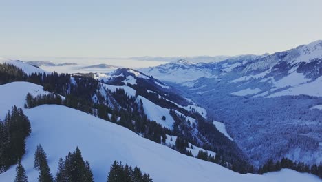 Silhouette-of-snow-covered-mountains-captured-by-a-drone-at-dawn