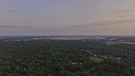Atlanta-Georgia-Aerial-v938-cinematic-drone-flyover-Hammond-Park-towards-Hapeville-capturing-sunset-views-of-ATL-Hartsfield-Jackson-Airport---Shot-with-Mavic-3-Pro-Cine---May-2023