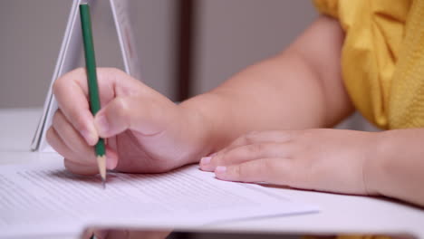 Close-up-of-a-woman-reading-and-meticulously-proofreading-an-article-while-doing-a-thorough-editing-of-a-written-work