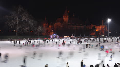 Tourists-Skating-On-Ice-Rink-At-City-Park-At-Night-In-Budapest,-Hungary