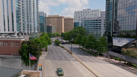 Slow-forward-shot-showing-waving-american-flag-in-City-of-Atlanta
