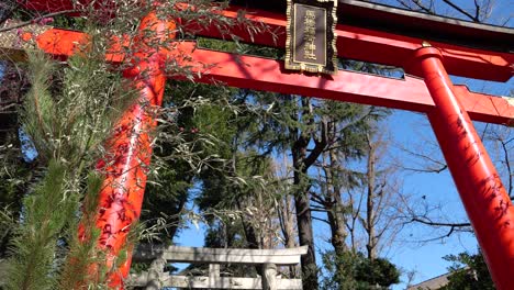 People-in-winter-visiting-shrine-with-typical-Torii-gate