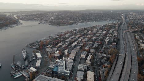 Aerial-establishing-shot-of-Lake-Union-surrounded-by-a-community-with-the-I5