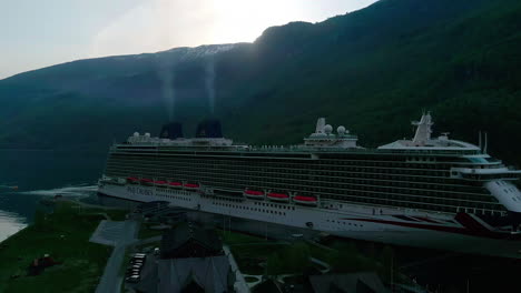 Cruise-ship-in-the-marina-of-famous-Flam,-Norway,-aerial-view