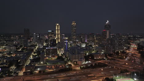 Atlanta-Georgia-Aerial-v907-epic-drone-flyover-Sweet-Auburn-capturing-freeway-traffic,-downtown-cityscape-and-flashing-lightning-strikes-over-the-dark-night-sky---Shot-with-Mavic-3-Pro-Cine---May-2023