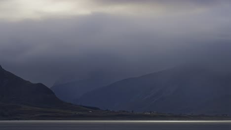 Fog-conquers-the-valley-where-there-road-passes-through-the-small-settlement-by-the-shore