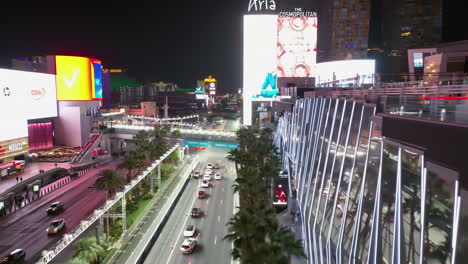 Aerial-view-following-the-illuminated-Las-Vegas-Boulevard,-the-Strip,-night-in-USA