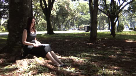 After-typing-on-laptop-with-concentration,-young-woman-takes-time-to-relax