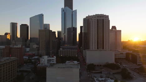 Aerial-view-of-the-Houston-Skyline-from-the-North-side,-backlit-by-the-evening-sun