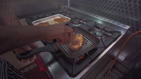 Caribbean-chef-preparing-jerked-chicken-in-a-bespoke-van