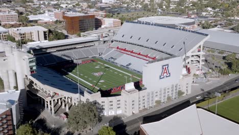 Arizona-Stadium-on-the-campus-of-the-University-of-Arizona-in-Tucson,-Arizona-with-drone-video-moving-in-a-circle-parallax