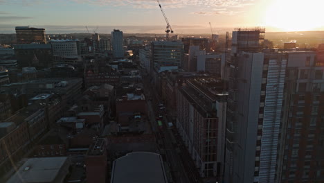 Establishing-Drone-Shot-over-Leeds-City-Centre-Wellington-Street-at-Sunrise-UK