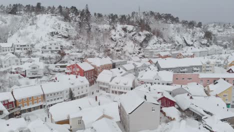 Kragero,-Telemark-County,-Norway---A-Delightful-Town-Adorned-with-a-Blanket-of-Snow-on-a-Wintry-Day---Orbit-Drone-Shot