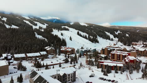 Fog-lift-cloud-layer-winter-snowy-early-morning-sunrise-aerial-drone-Copper-Mountain-Colorado-ski-resort-i70-Eagle-Flyer-lift-center-village-snowboarding-half-pipe-Ikon-Epic-pass-parking-lot-upward