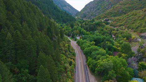 Aerial-over-Ogden-Utah-Canyon-with-beautiful-Pine-Forest-and-hotel-next-to-the-main-road