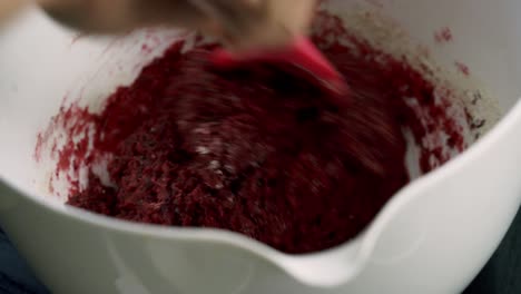 Mixing-up-red-beet-batter-in-white-bowl-to-make-valentine's-day-red-velvet-chocolate-beet-muffin