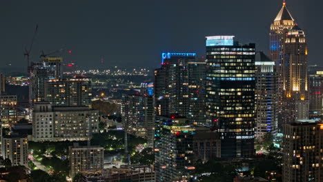 Atlanta-Georgia-Aerial-v902-zoomed-hyperlapse-drone-flyover-midtown-capturing-vivid-night-cityscape-with-illuminated-skyscrapers-on-the-skyline-of-metropolitan---Shot-with-Mavic-3-Pro-Cine---July-2023