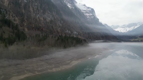 Klöntalersee-Glarus-Switzerland-mystical-forest-with-mist-at-lake-side